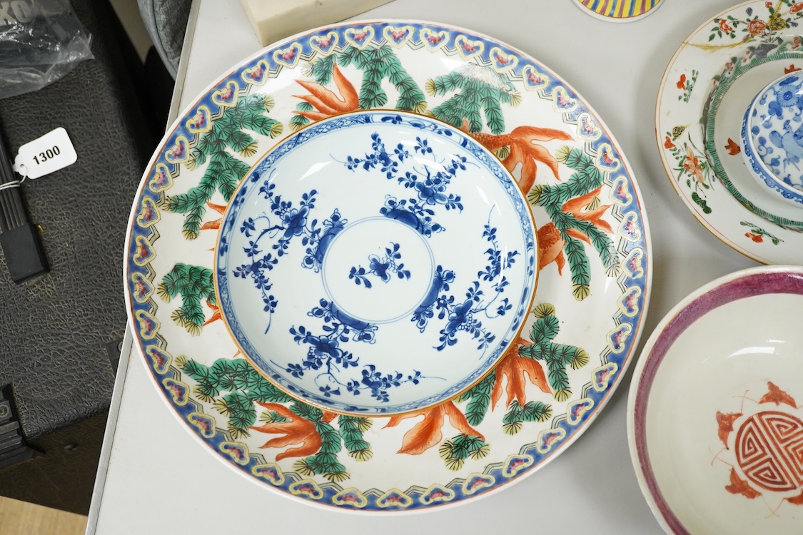 A collection of Chinese ceramics, 18th century and later to include a blue and white vase and cover, ‘goldfish’ charger and various bowls, largest 36cm in diameter
